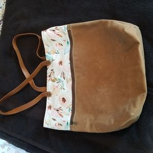 Brown leather canvas tote.